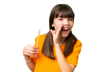 Little caucasian girl brushing teeth over isolated background whispering something