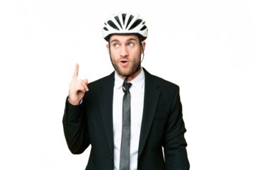 Business person with a bike helmet over isolated chroma key background thinking an idea pointing the finger up