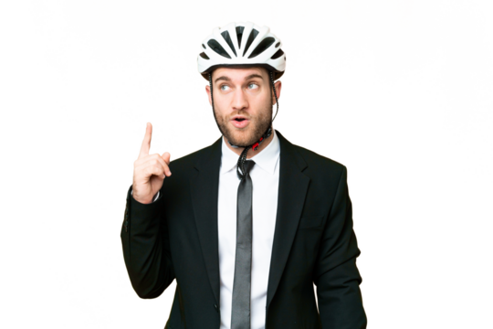Business person with a bike helmet over isolated chroma key background thinking an idea pointing the finger up - Powered by Adobe
