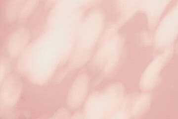 Abstract light shadow of pink leaves bokeh background. Natural diagonal leaves tree branch pastel beige shadows and sunlight on wall. Shadow overlay effect foliage mockup, graphic layout, wallpaper
