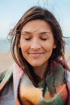 Brunette Woman Smiling With Eyes Closed