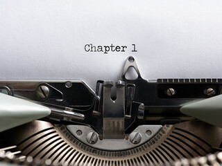 The word chapter 1 written with a vintage typewriter. Storytelling, book writing or authorship...