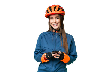 Young cyclist woman over isolated chroma key background sending a message with the mobile