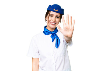 Airplane stewardess over isolated chroma key background counting five with fingers