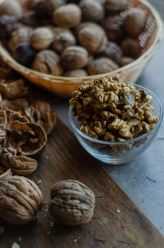 peeled walnuts in a vase and in a shell in a basket
