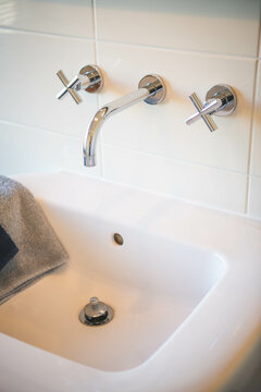 A bathroom sink with a tap