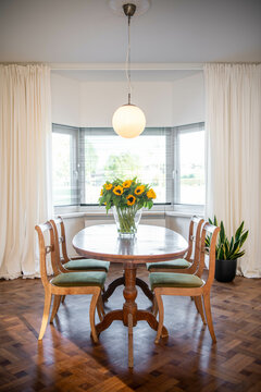 a dining table with sunflowers