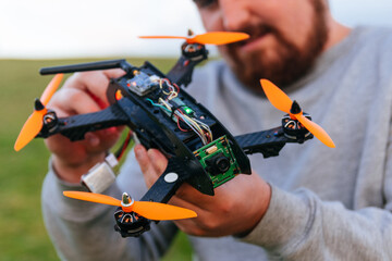 Man holding a racing drone. FPV high-speed racing drone.