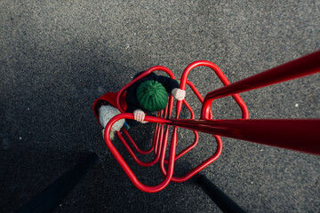 children on red playground climbing on spring day