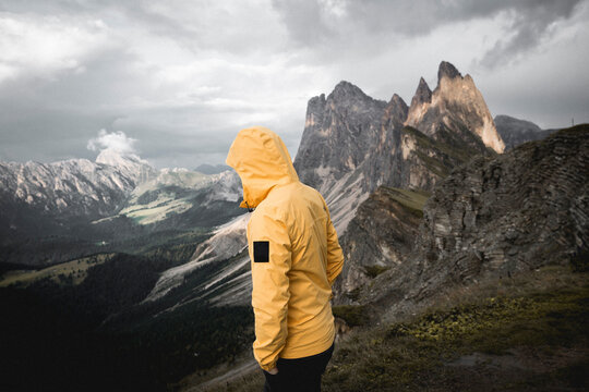 Man in Yellow  jacket in mountains