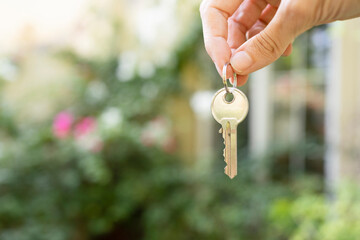 Hand of woman holding house key