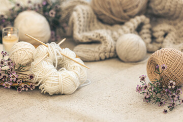 Cozy home composition with threads for knitting.