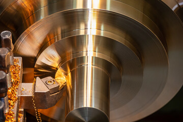 Closeup scene the lathe machine finish cut the brass parts by lathe tools.
