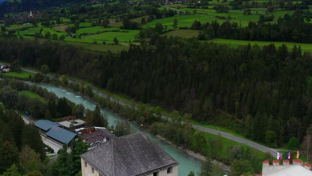 Aerial Flying Over Castle Bruck Beside River Isel In Austria With Countryside Landscape In Background 