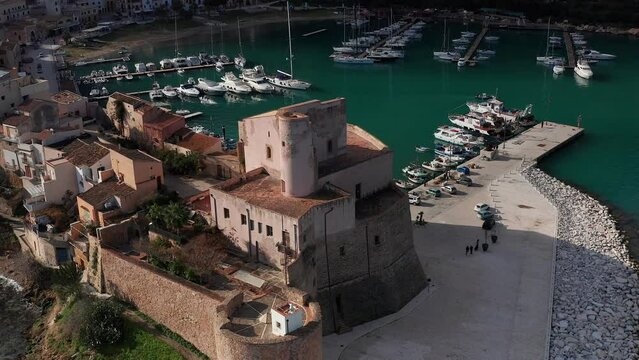 Aerial Close Up View Of Castello Arabo Normanno Located Beside Castellammare Del Golfo Port. Dolly Back, Ascending Shot