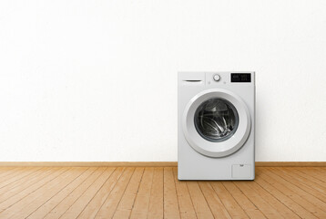 Washing machine in empty interior room.
