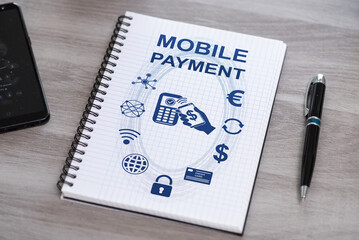 Mobile payment concept on a notepad