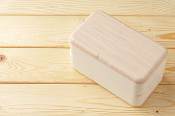 New empty plastic lunch box on a wooden background