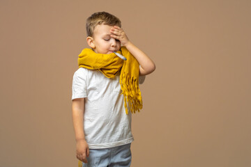 Little sick boy with digital thermometer in mouth on light background. Copy space.