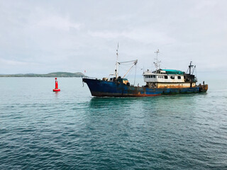 Fototapeta premium old rusty fishing boats in conakry harbour