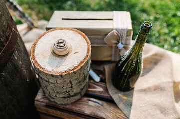 Wedding ring on wooden stump. Engagement. Wedding decor. Decorations against the background of wooden box.