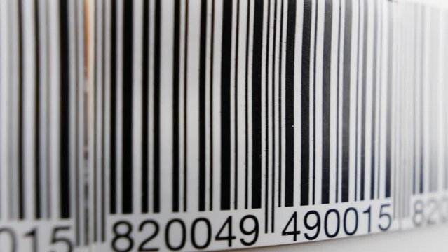 Barcode. Product code label on a conveyor belt. Production line, close up shot