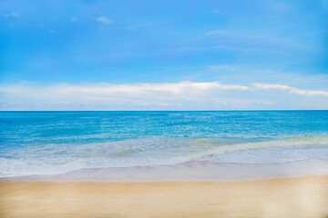 Fototapeta na wymiar Beach with blue sea water and blue sky