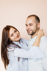 man and a woman in love pose for a family portrait