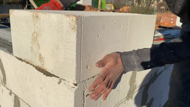 Foam block laying on a special mortar for laying blocks. 4k video footage