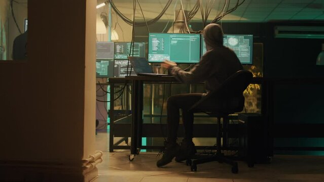 Male spy creating breach of security after gaining access to network system, hacking computer to steal government information. Man doing hacktivism work, ransomware and identity theft.