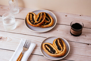 homemade puff pastry cookies with poppy seeds in the form of rab