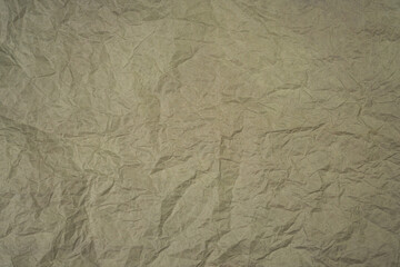 Brown crumpled paper. Abstract background. Banner. Top view. Copy space. Selective focus.