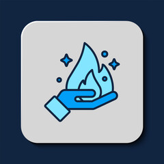 Filled outline Hand holding a fire icon isolated on blue background. Vector