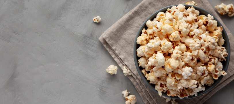 Homemade Kettle Corn Popcorn with Salt in a Bowl, top view. Flat lay, overhead, from above. Space for text.