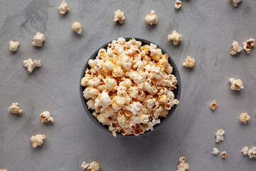 Fototapeta na wymiar Homemade Kettle Corn Popcorn with Salt in a Bowl, top view. Flat lay, overhead, from above.