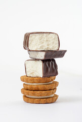 Chocolate Protein bar filled with coconut sauce and cookies, white background
