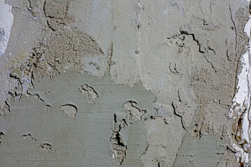 close-up abstract concrete wall background with spots of gray plaster, horizontal.