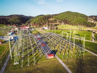 Electrical substation in the suburbs, fields and forest in the surrounding area 