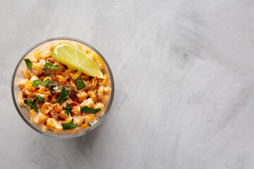 Homemade Mexican Corn Elote Esquites, top view. Flat lay, overhead, from above. Space for text.