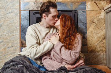 Sensual kiss of a couple in love. A brunette young man sexually touches the neck of his girlfriend, kissing her on the lips.