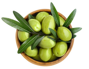 Delicious green olives with leaves in a wooden bowl cut out