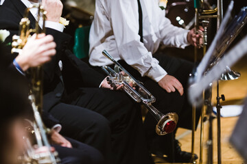 Trumpet players of a band taking a break before a concert in the theatre