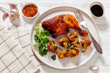 baked chicken leg with spicy roast cauliflower