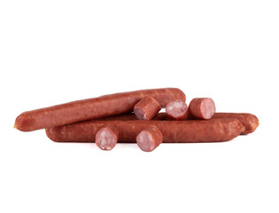 Several whole semi-smoked sausages and slices of thin sausage on a white background.