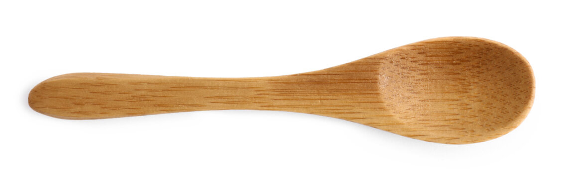 Wooden spoon on white background, top view