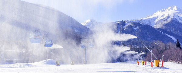 Bansko, Bulgaria, Bulgarian winter ski resort panorama with gondola lift cabins, Pirin mountain peaks view and slope © Nataliya