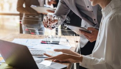 Business team hand Project manager working and update tasks and Gantt chart scheduling virtual diagram with laptop in office.