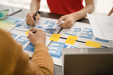 ui designer brainstorming about mobile app interface wireframe design with customer breif and color...