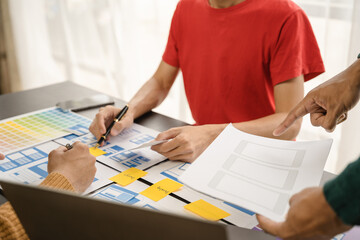 ui designer brainstorming about mobile app interface wireframe design with customer breif and color...