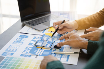 ui designer brainstorming about mobile app interface wireframe design with customer breif and color...